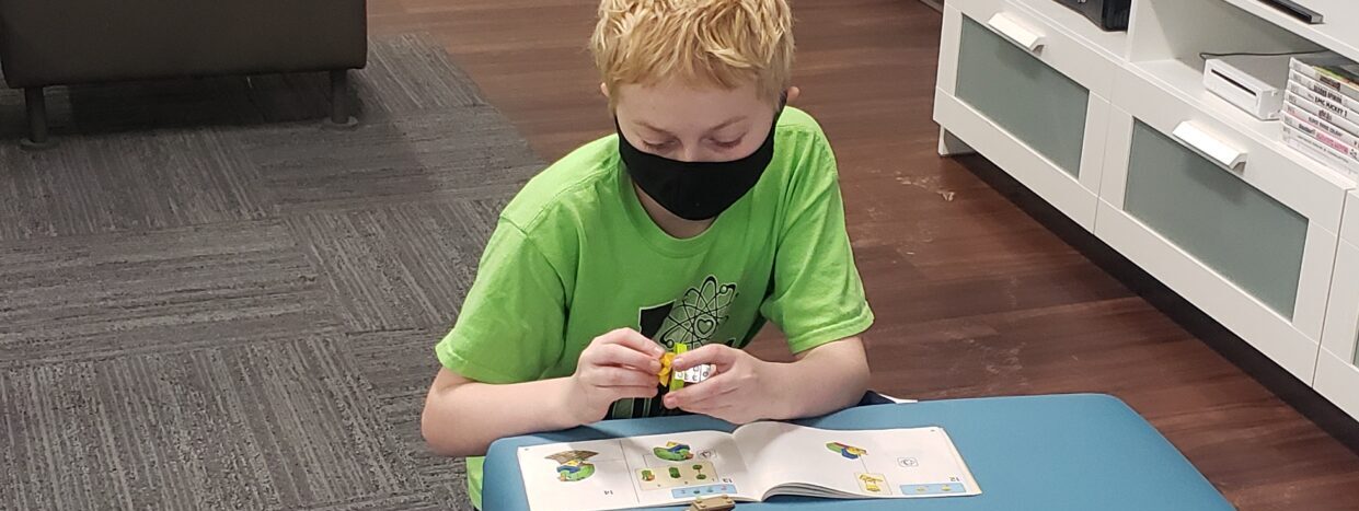 boy building legos