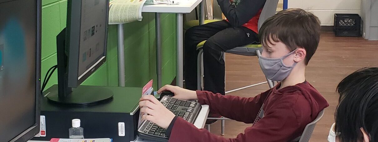 kid at computer
